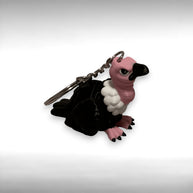 Keychain shaped like a vulture on a white background