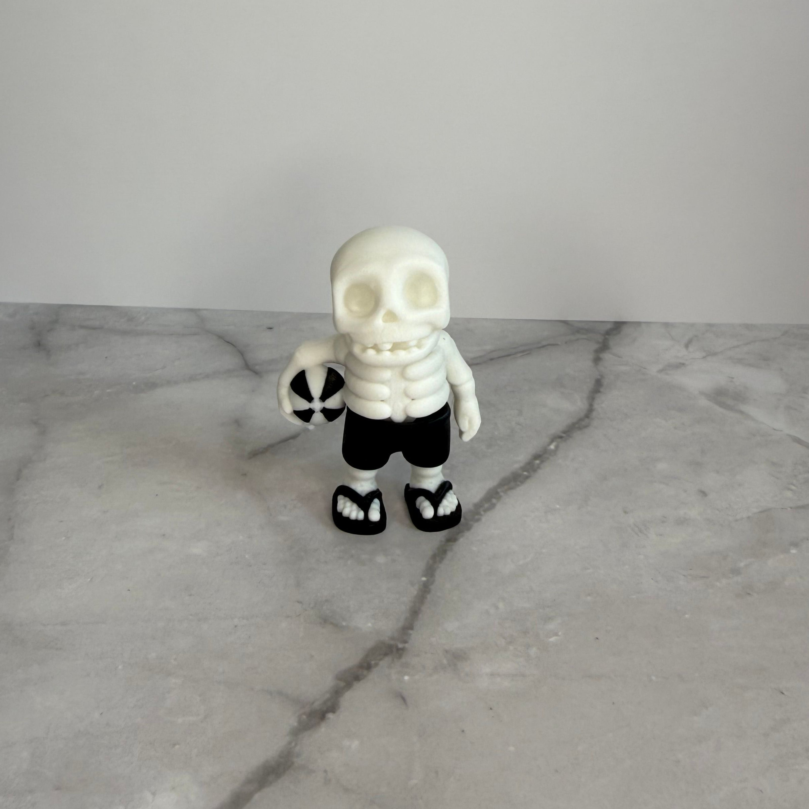 Skeletal figure with a beach ball on a gray background