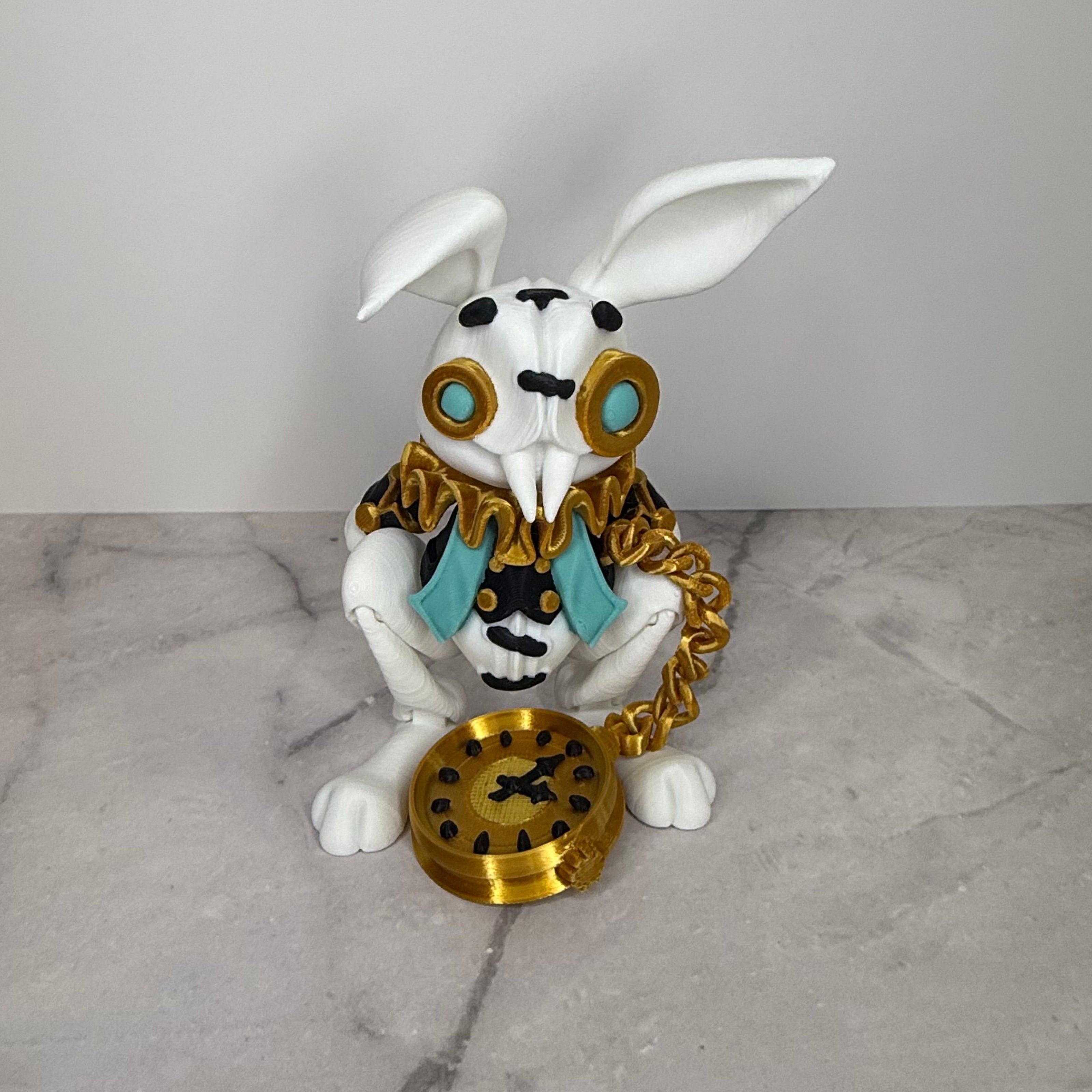 Decorative rabbit figurine with goggles and a clock on a marble surface