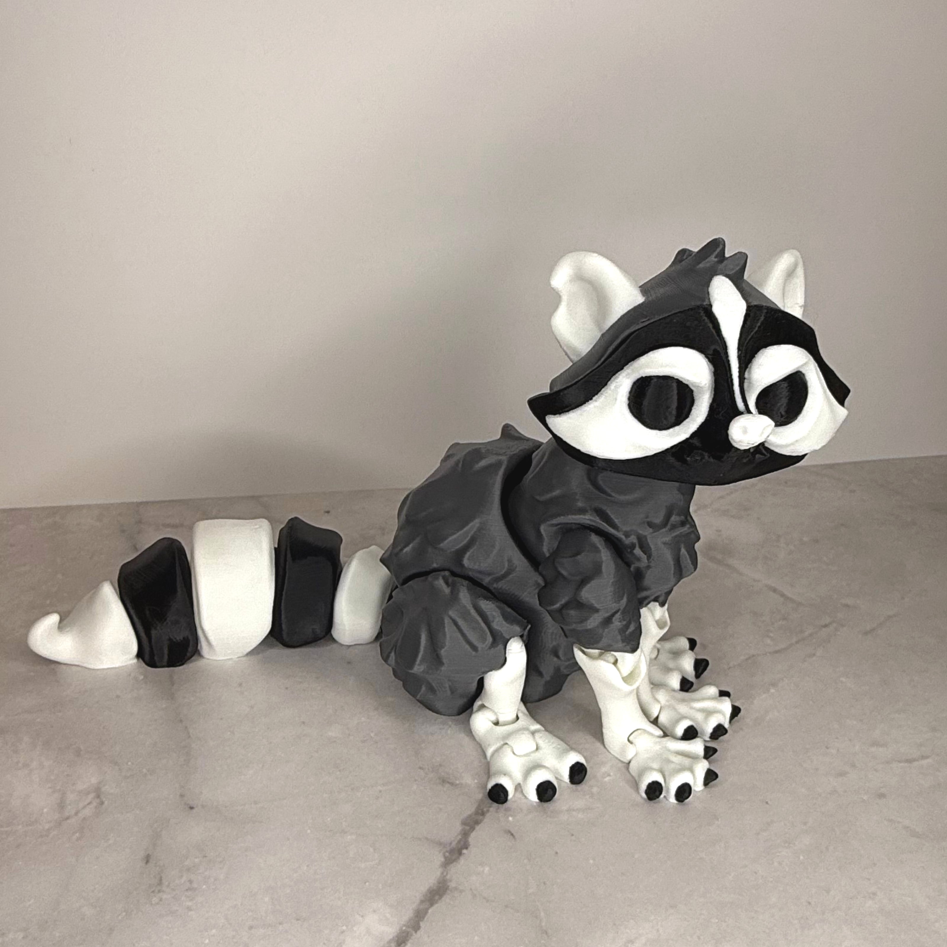 Toy figure of a black and white animal on a gray surface