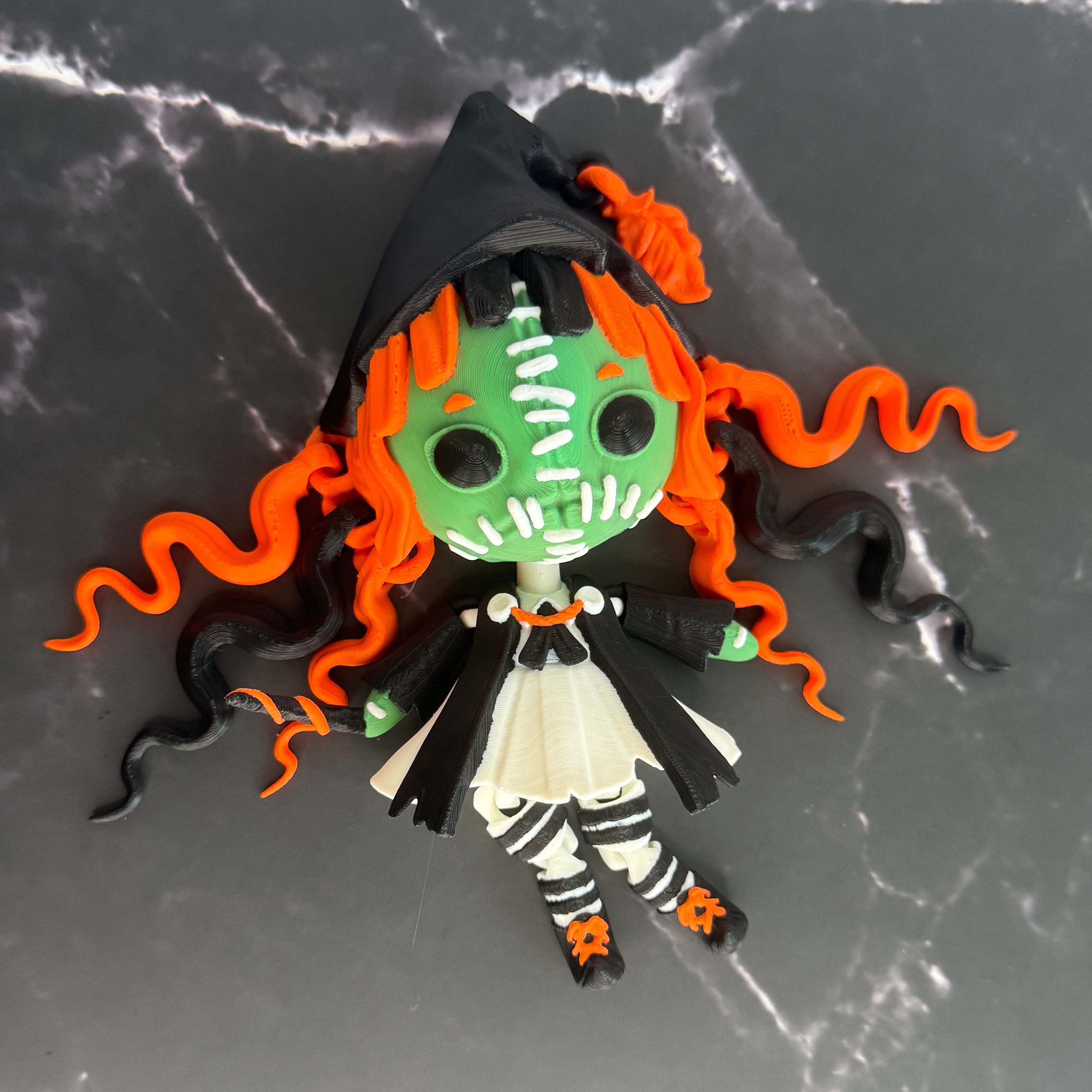 Toy figure with orange hair and green face on a dark textured background