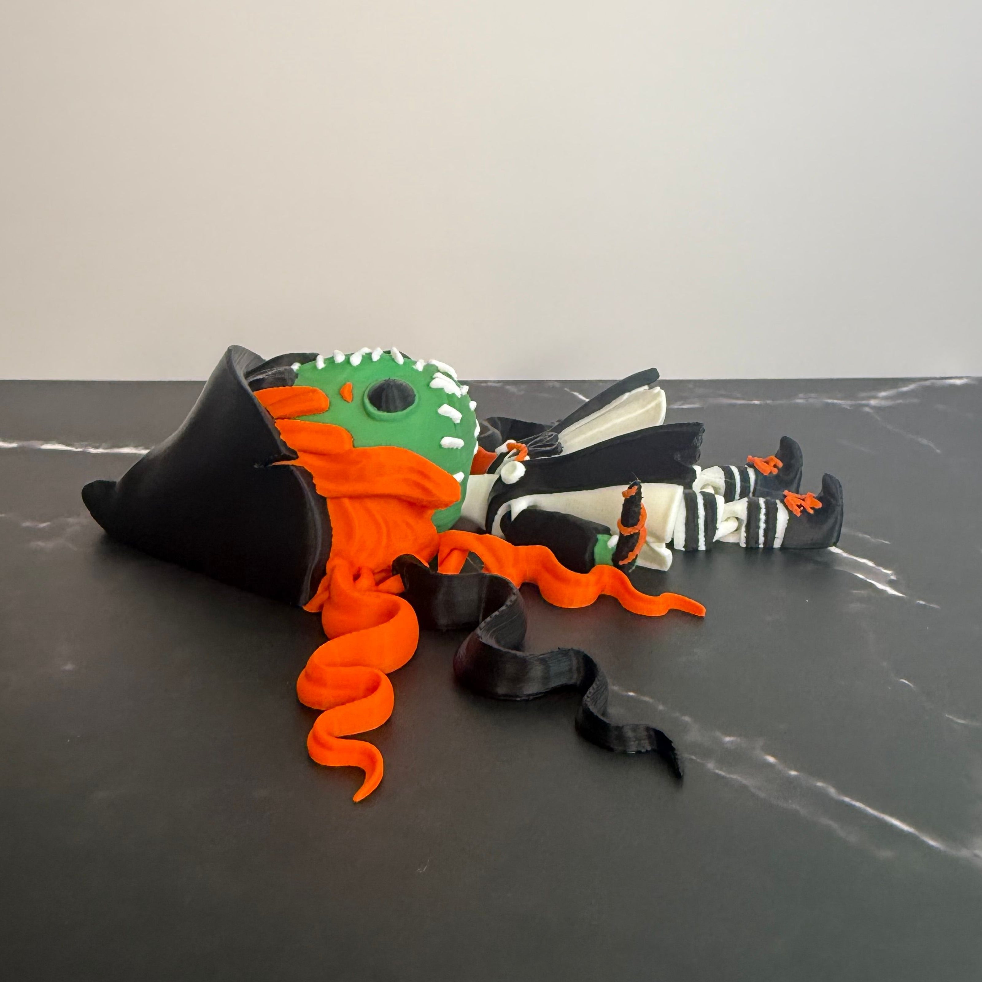 Toy figure with orange hair and green face on a dark textured background