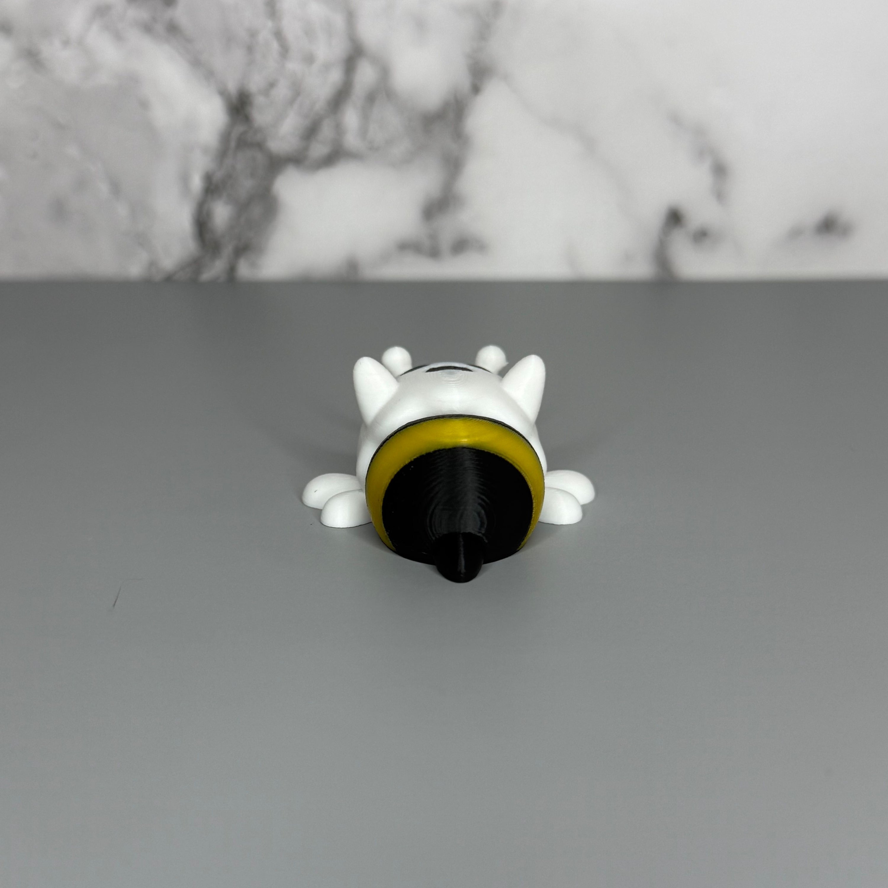 Ghost figure with white wings and a black and yellow bee-shaped lower body on a gray background.
