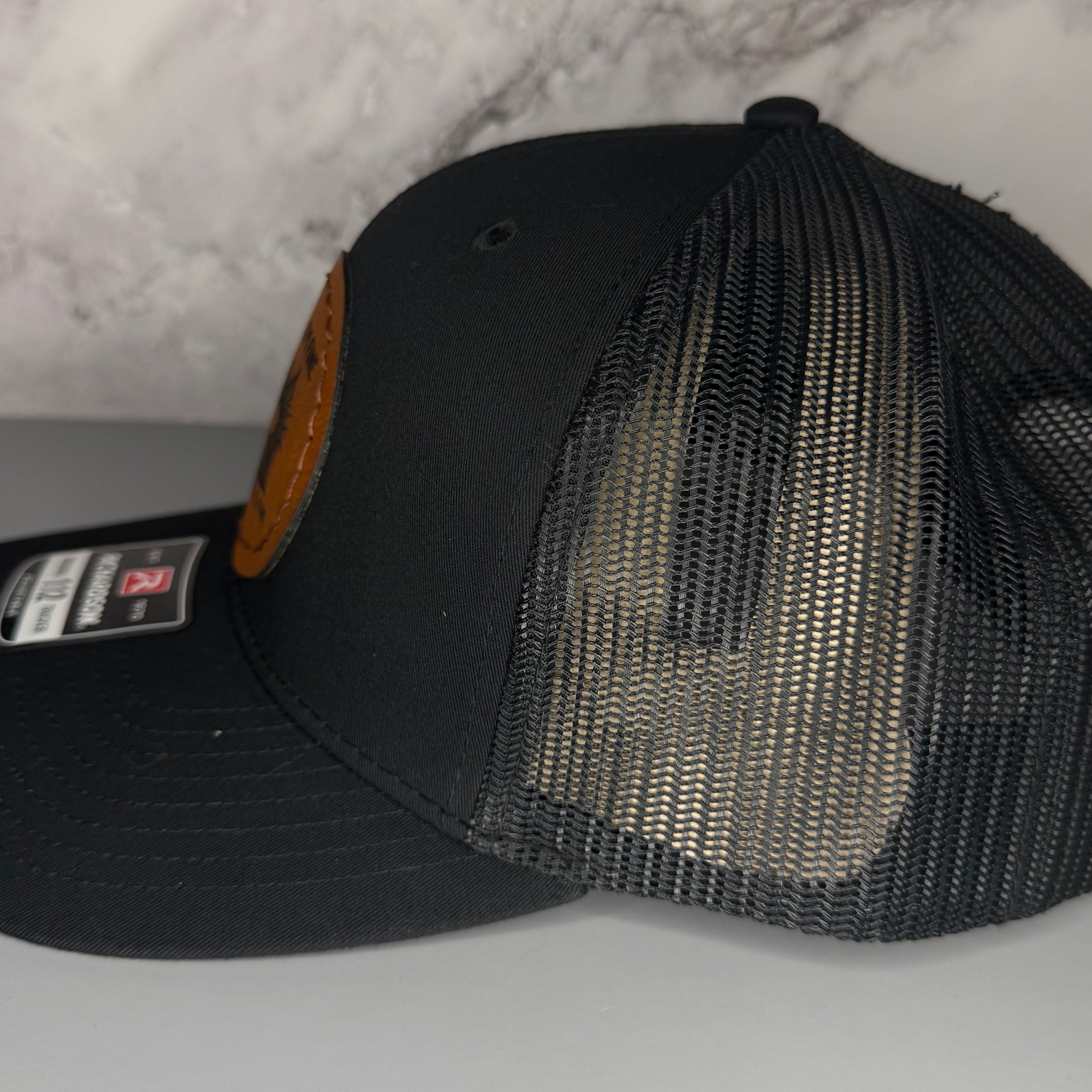Black mesh cap on a light gray background