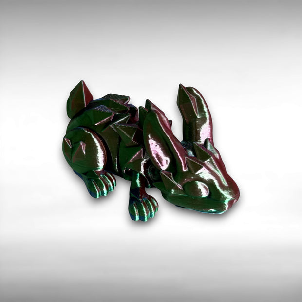 Multicolored 3D printed rabbit with crystal-like features against a white background