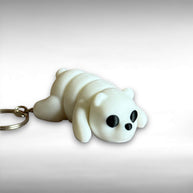 3D printed white bear-shaped keychain on a light gray background