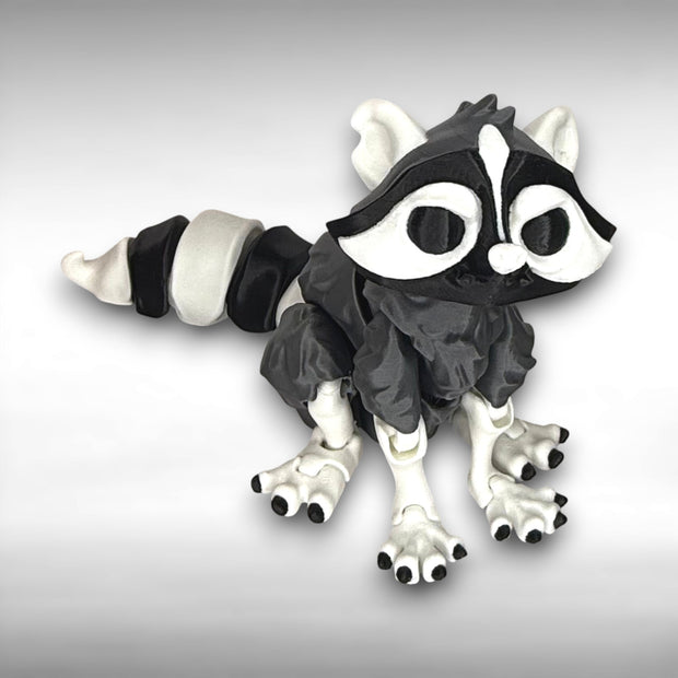 Black and white creature toy on a gray background
