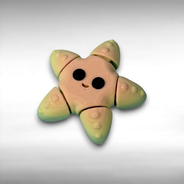 Smiling star-shaped figure with a gradient rainbow color pattern and black eyes on a white background