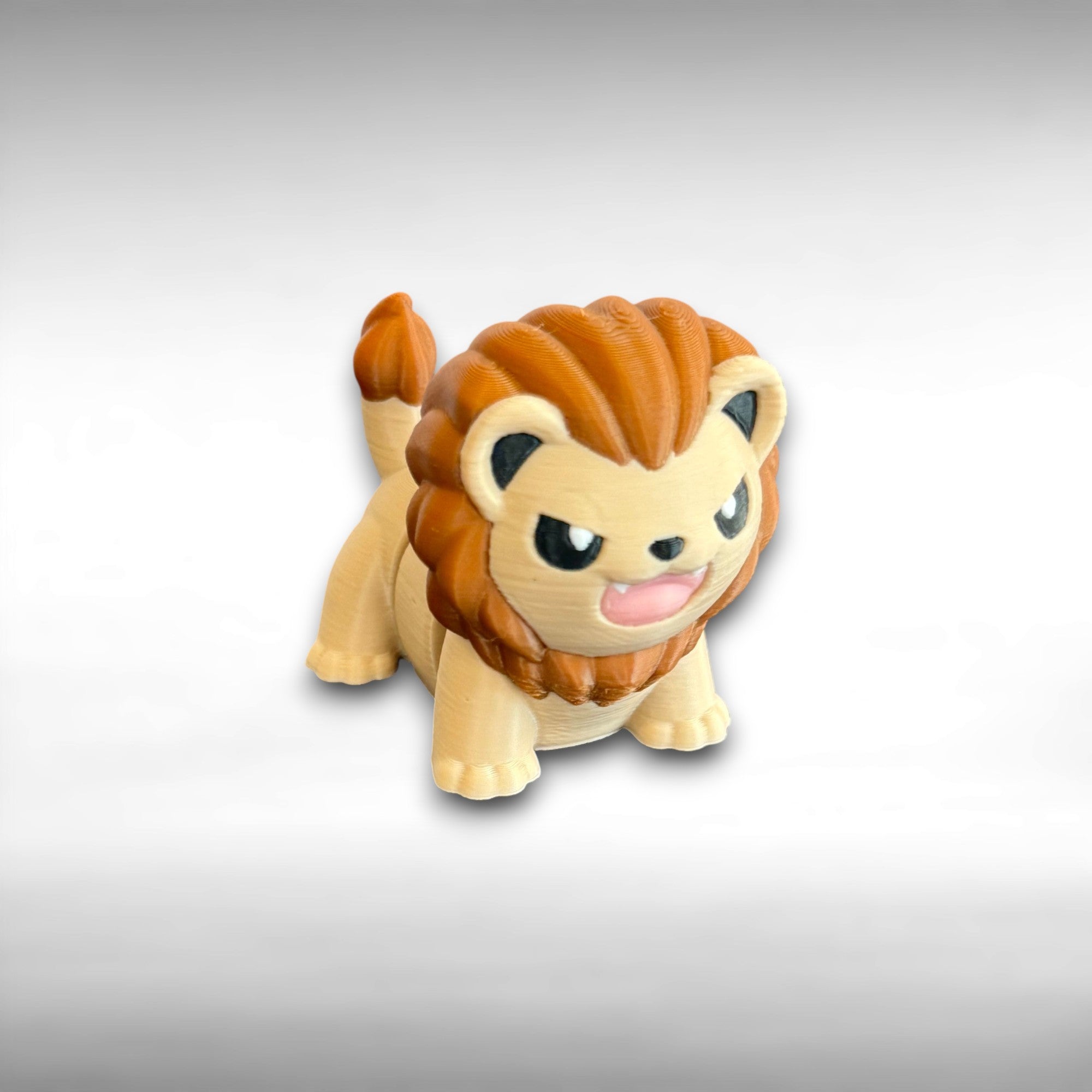 Toy lion figure on a gray background