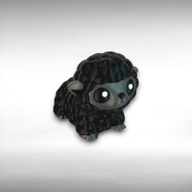 3D-printed articulated black and gray sheep figurine on a light background