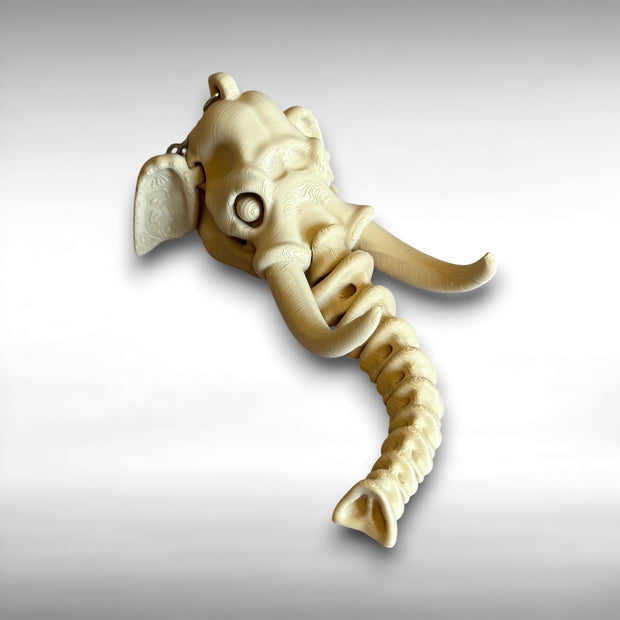 3D printed beige elephant skull with articulated skeleton-like trunk against a white background