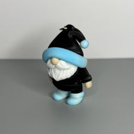 Gnome-shaped keychain in black with a blue/white gradient and black hat, white beard, and blue/white gradient shoes. 