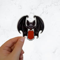 Vampire Bat Drinking Blood Bag Vinyl Sticker - Spooky Halloween Sticker, Dark Aesthetic, Gothic Decor for Laptop or Water Bottle