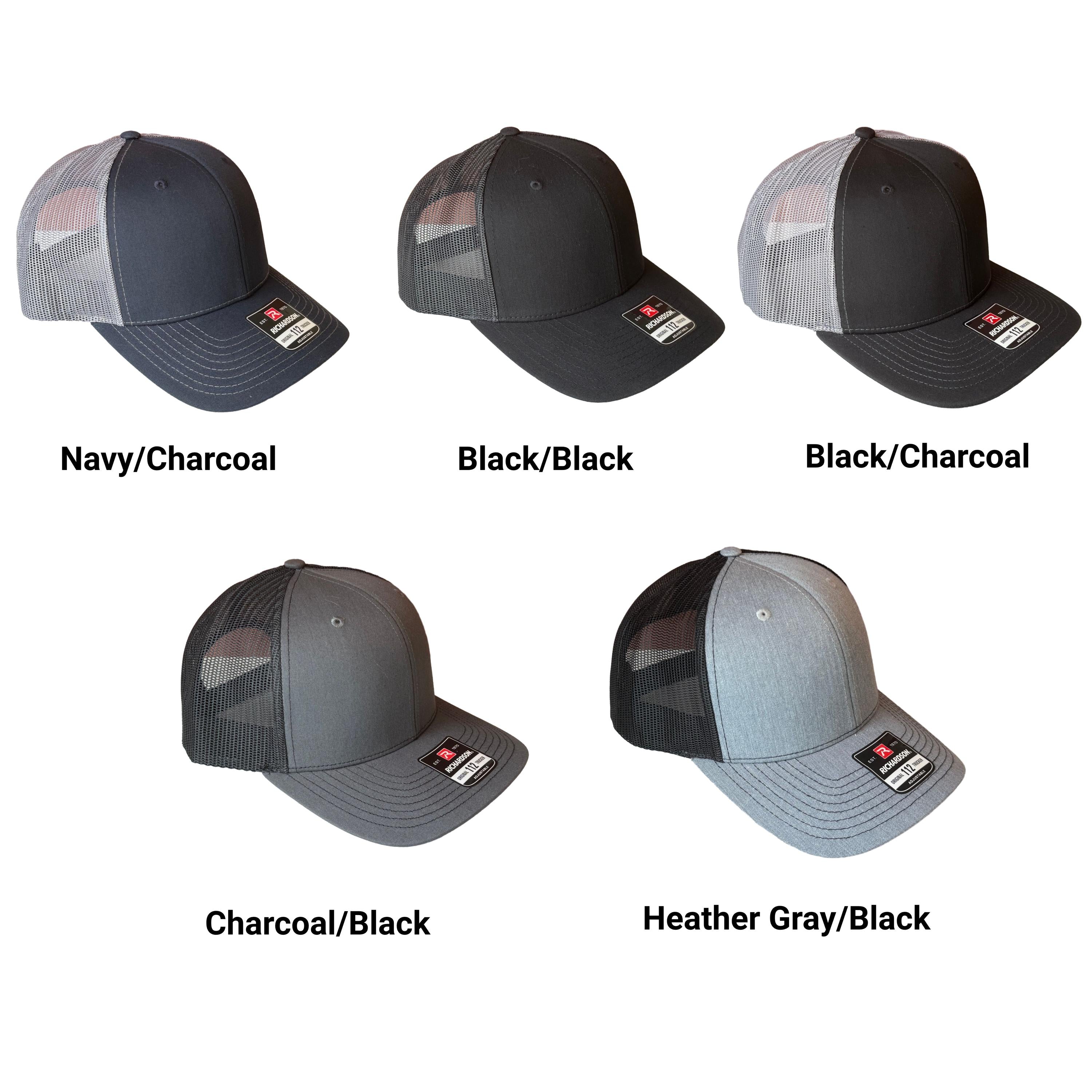 5 trucker hats with words stating the front/back color scheme options of navy/charcoal, black/black, black/charcoal, charcoal/black, and heather gray/black.