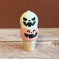 Pink and White 3D printed ice cream cone keychain with smiling and mischievous expressions on the ice cream scoops.