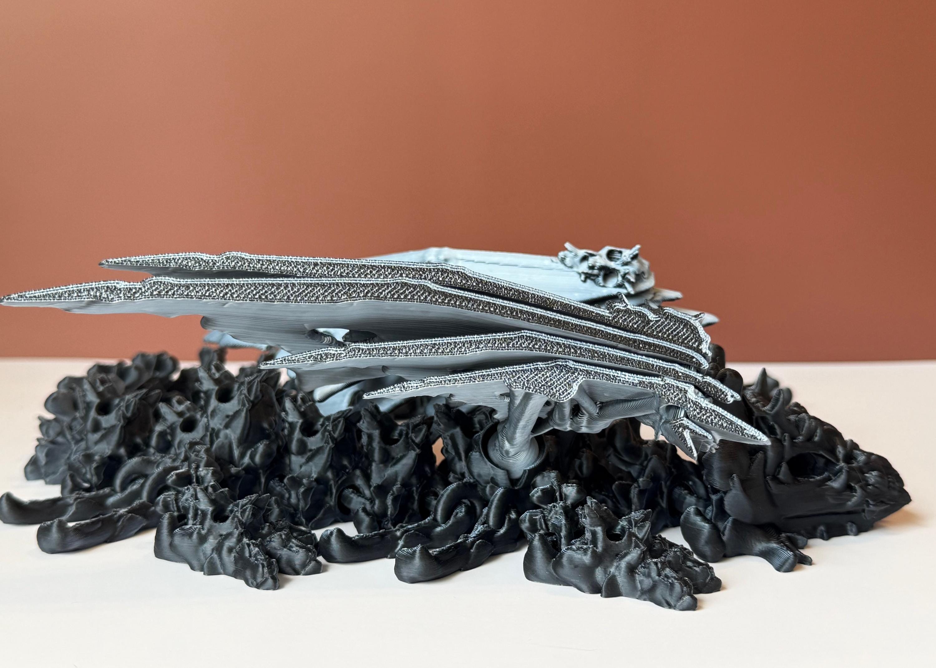 Winged black and white 3d printed dragon with a hollow theme consisting of skulls and bone-like features against a white and brown background